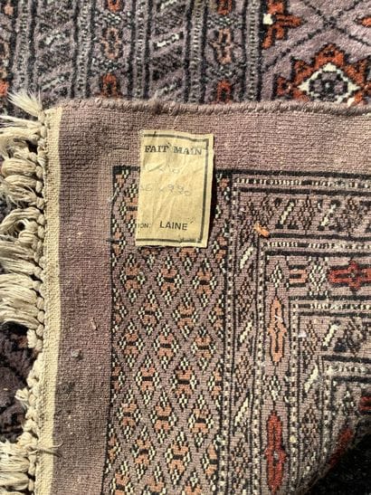 Large, handmade Bukhara-style rug in shades...