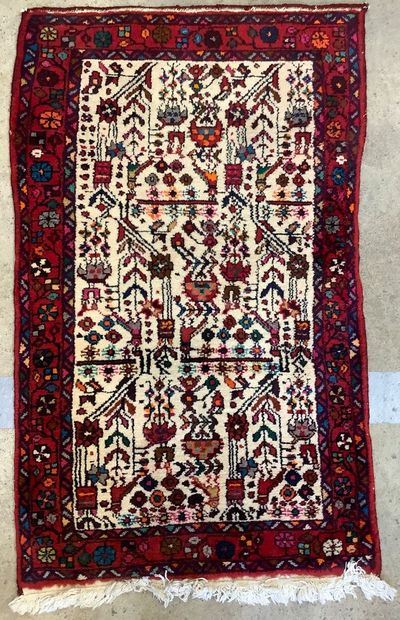 2 rugs: a handwoven wool Bukhara-style hallway...