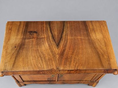 A low, rectangular, veneered Charles X sideboard...