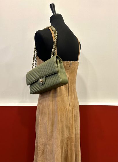 CHANEL 
Beige suede dress with 100% beige...