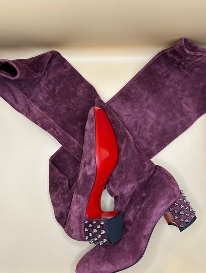 LOUBOUTIN 
Pair of purple suede boots, the...