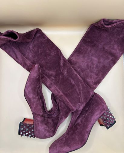 LOUBOUTIN 
Pair of purple suede boots, the...