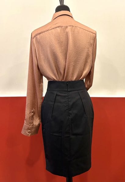 VALENTINO
Black virgin wool skirt with bow,...