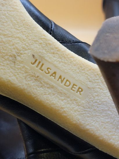 JIL SANDER
Paire de boots à talon en cuir...