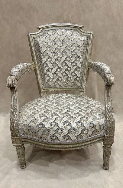 Child's armchair in molded, carved and cream...