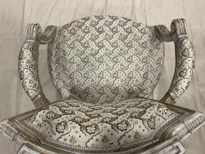 Child's armchair in molded, carved and cream...