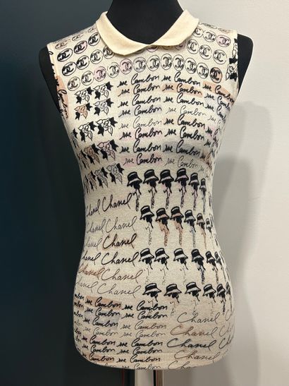 CHANEL 
100% cashmere tank top with camellia...