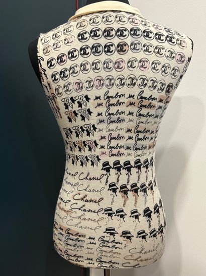 CHANEL 
100% cashmere tank top with camellia...