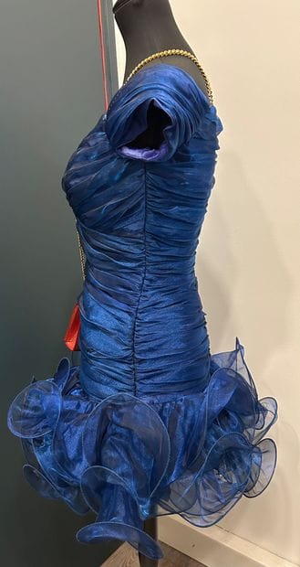 DAVID FIELDEN 
Blue frilly cocktail dress...