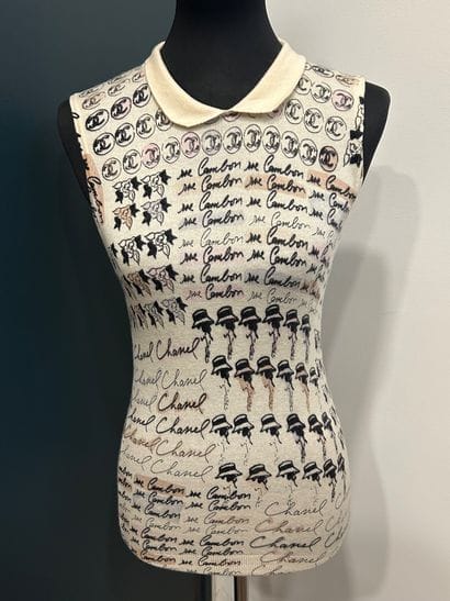 CHANEL 
100% cashmere tank top with camellia...