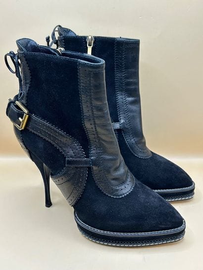 DIOR 
Paire de bottines noires compensées...