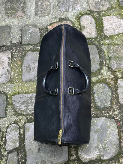 LOUIS VUITTON 
Sac de voyage 