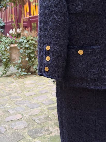 CHANEL 
Elegant and timeless skirt suit model...