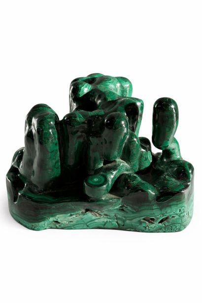Free-form group in carved malachite. 
20th...