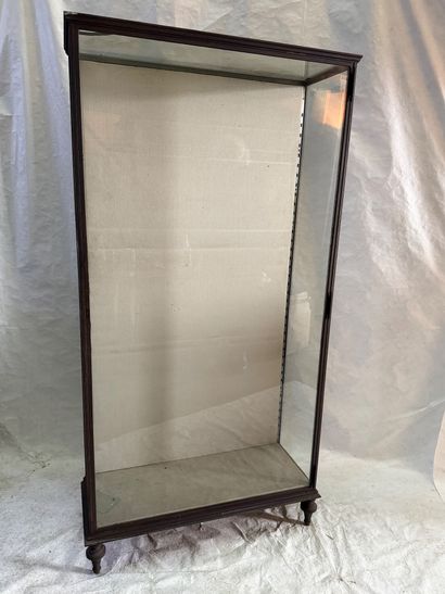 Large wrought-iron display case resting on...