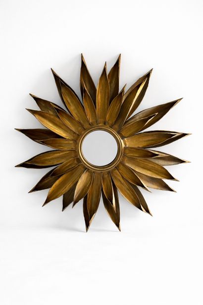 Large gilt metal sunburst mirror. 
Circa...