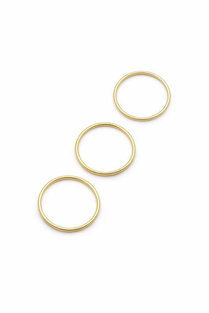 Suite of three wedding bands in 18K (750/1000)...