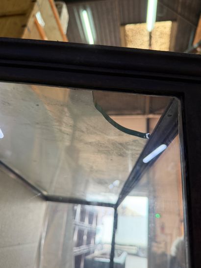 Large wrought-iron display case resting on...