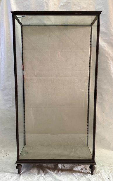 Large wrought-iron display case resting on...
