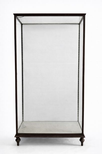 Large wrought-iron display case resting on...