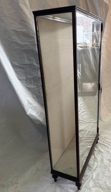 Large wrought-iron display case resting on...