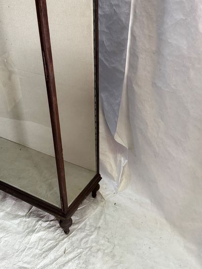 Large wrought-iron display case resting on...