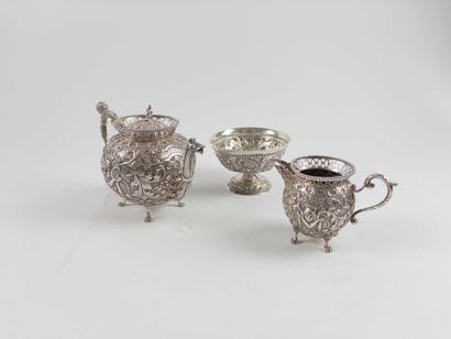Teapot and milk jug. 
Each resting on four...