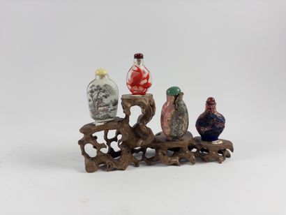 China. 
Set of four snuff bottles. Enameled...