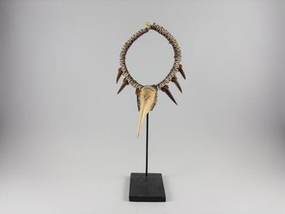 Asmat. 
Hunter's ornament decorated with...