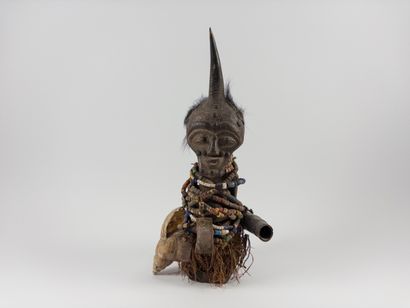 Songye. 
Fetish statuette wrapped in pearl...