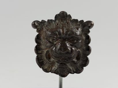 Mascaron. 
Depicting a lion's head adorned...