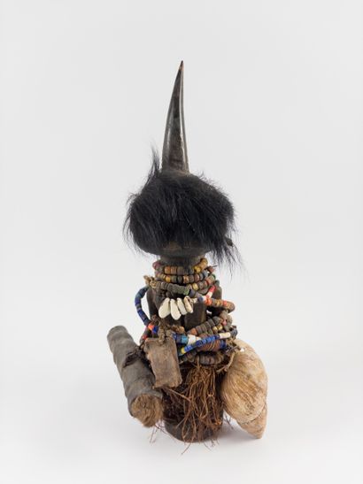Songye. 
Fetish statuette wrapped in pearl...