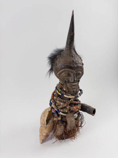 Songye. 
Fetish statuette wrapped in pearl...