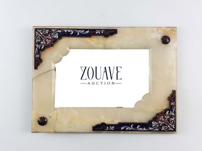Table mirror. 
Onyx lined with enameled plates....