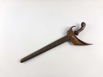 Indonesia.
Kriss and scabbard. Handle decorated...