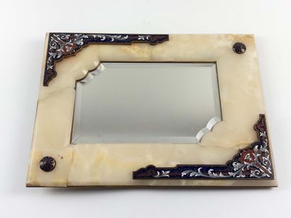 Table mirror. 
Onyx lined with enameled plates....