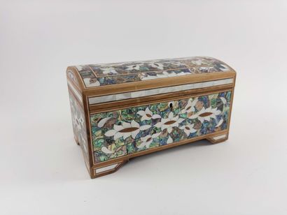 Dome-shaped case.
Resting on four feet and...