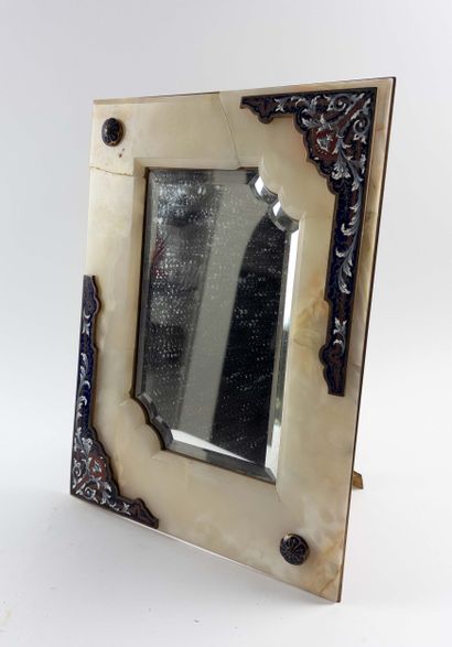 Table mirror. 
Onyx lined with enameled plates....