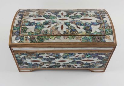 Dome-shaped case.
Resting on four feet and...