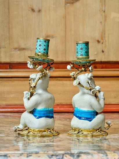 A pair of polychrome cookie and blue porcelain...