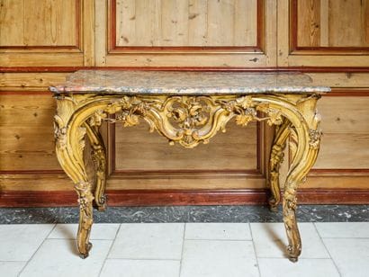Large curved console table in carved, molded...