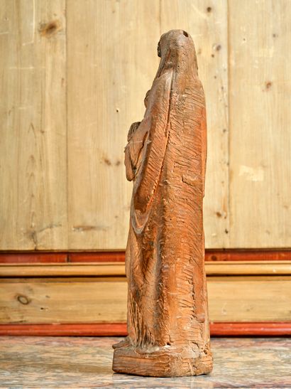 Terracotta sculpture depicting a clothed...