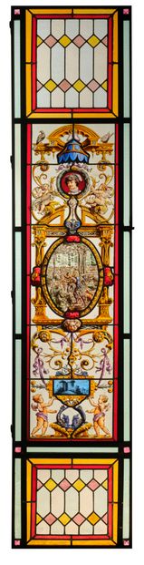 Pair of stained glass windows in polychrome...