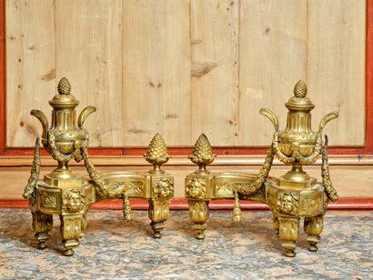 Pair of chased and gilded bronze andirons...