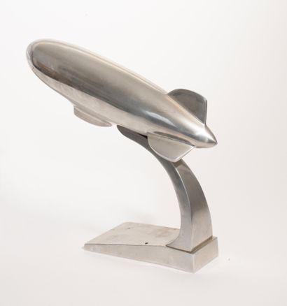 Aluminum Zeppelin resting on its base. 
Marked...