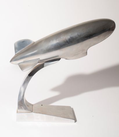 Aluminum Zeppelin resting on its base. 
Marked...