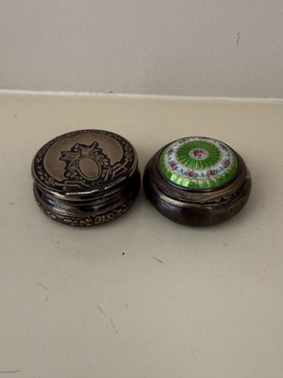 Round silver pill box, the lid chased with...