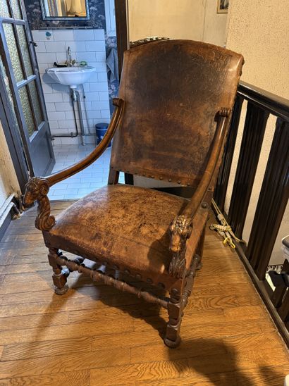 Carved wood armchair with leather backrest,...