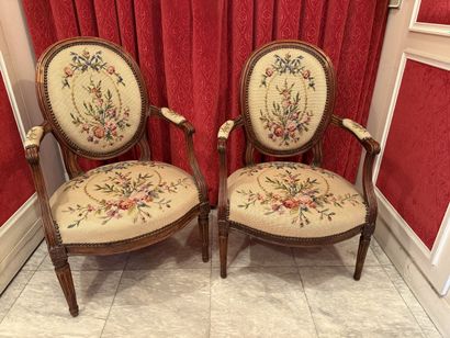 Two armchairs in molded natural wood, the...