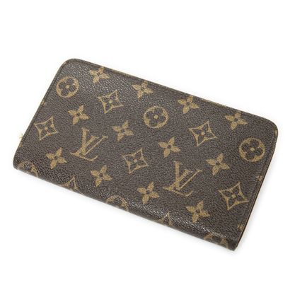 LOUIS VUITTON
Monogram canvas wallet, gilded...